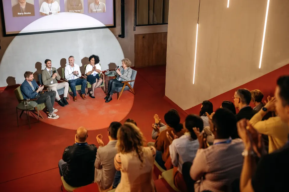 Leaders speaking to an audience at an event