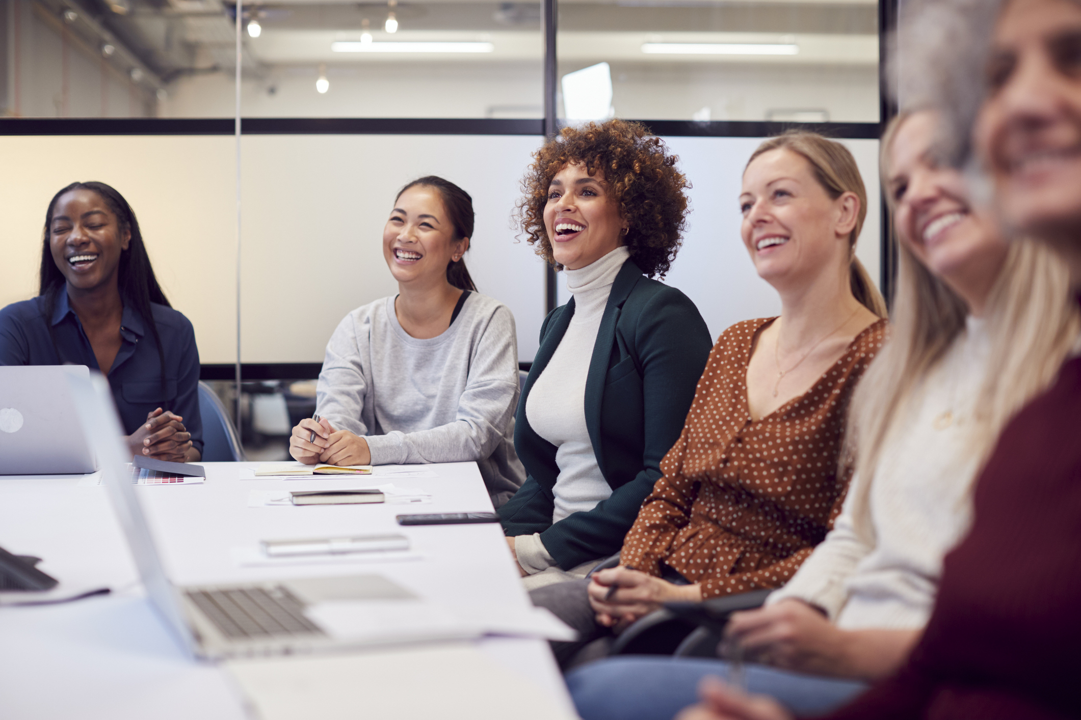 Women seated at a conference table